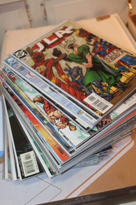 lot 202 image: Lot of (37) DC Comics JLA Comic Books w Sleeves