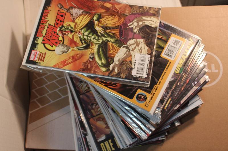 lot 238 image: Lot of (50) Marvel Comics Avengers Comic Books w Sleeves & Wizard World Chicago 2003