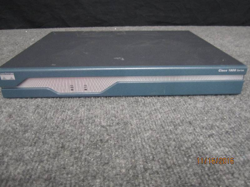 lot 19 image: Cisco 1841 router powers on and pas...
