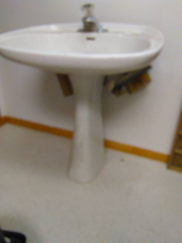 lot 36 image: White Porcelain Pedestal Sink with hardware  no chips or cracks