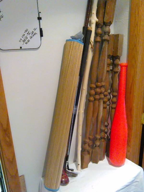 lot 64 image: Walking stick, wood spindles, golf clubs and more  see pictured for full detail.