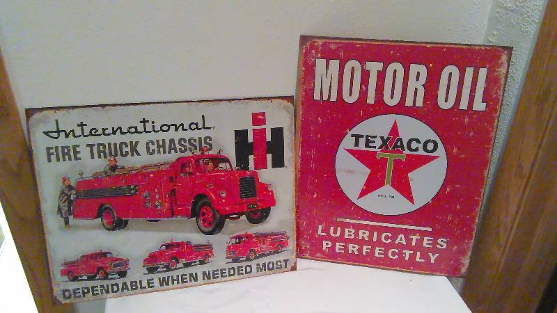 lot 114 image: Texaco and International Truck Metal Mancave Signs (2)