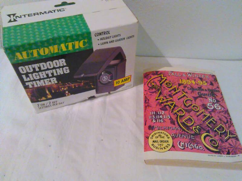 lot 151 image: Outdoor light timer, NIB and Montgomery Ward Encyclopedia of catalogs