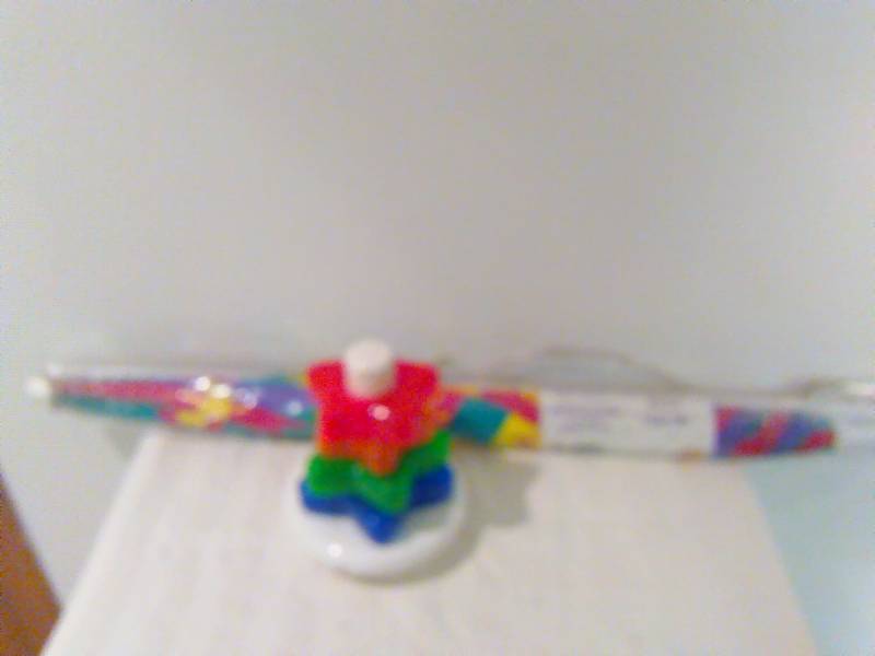 lot 153 image: Winnie the Pooh Beach Umbrella and Light up, sound Fisher Price Stackable Stars Activity Toy, New