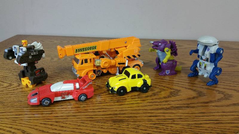 lot 57 image: (6) 1980s Transformers - Dinobot, Construction, Etc.