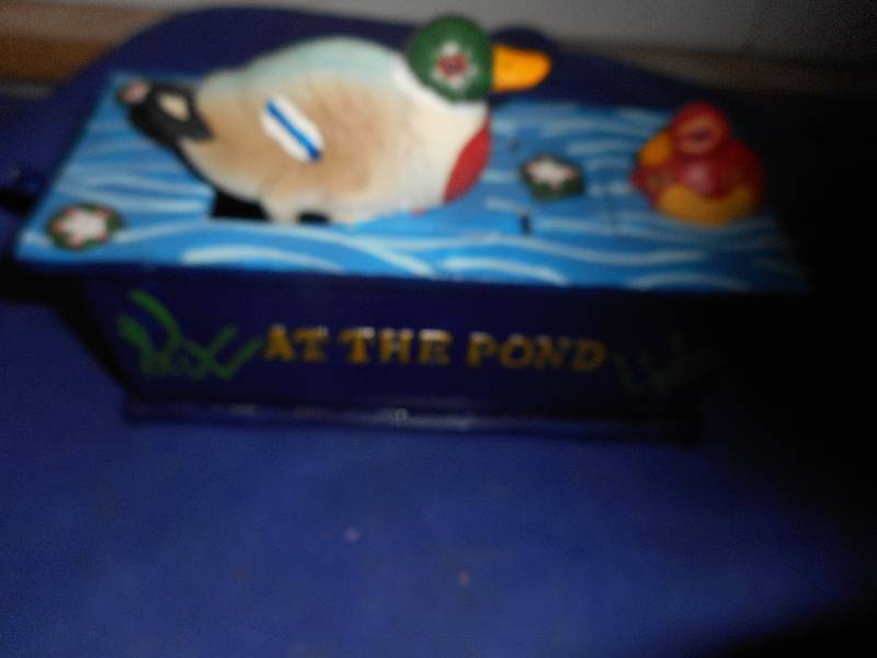 CAST IRON AT THE POND CAST IRON COIN BANK