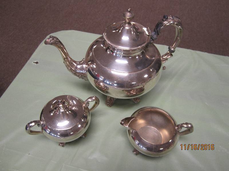 Silver on copper tea set...