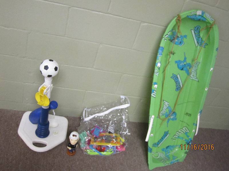 Lot of toys and a sled, bags and pu...