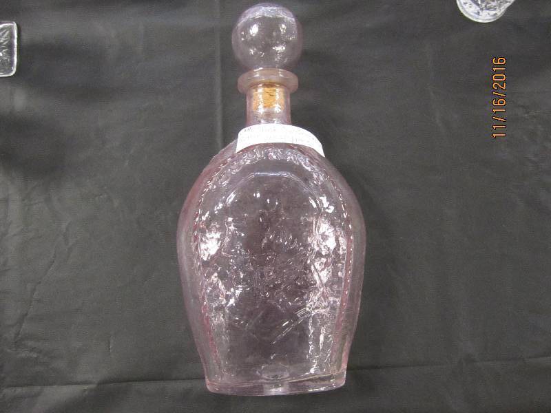 Pink commemorative bottle with stop...