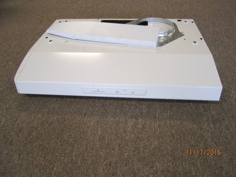Over the stove range hood...