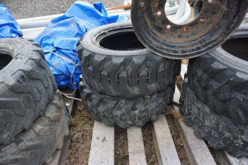 lot 11 image: Set of 4 Skid Loader Tires and Rims Size 10 x 15