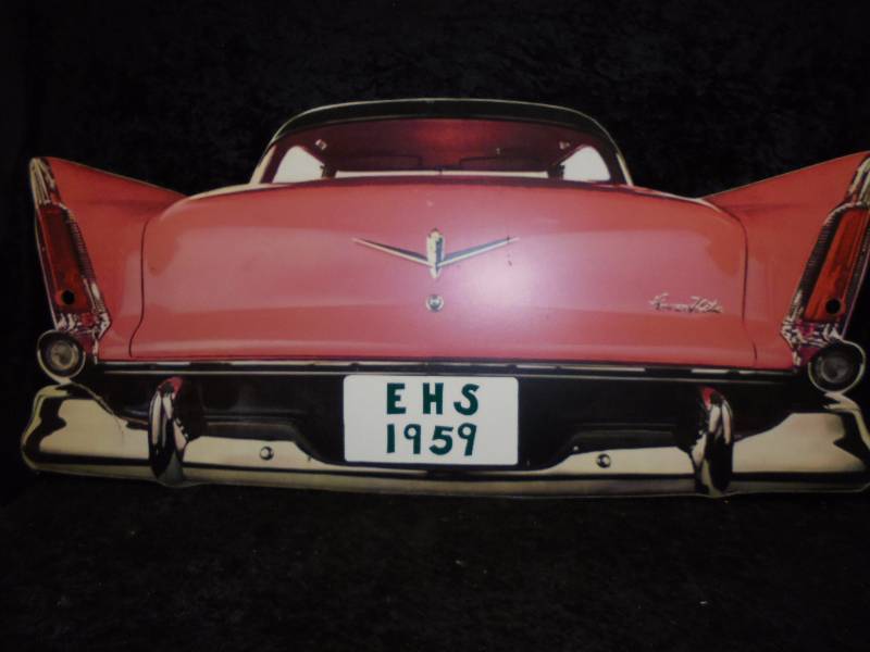 lot 83 image: 1959 Pink Cadillac Sign, Melamine Telepanel, 45x20, rip on bumper