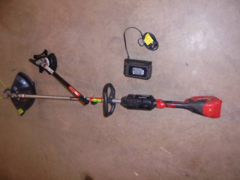lot 21 image: TroyBilt Cordless 20v Weed Whip & Trimmer wCharger