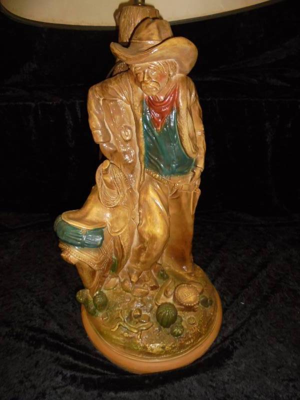 lot 28 image: Cowboy & Saddle Lamp 36hx17r