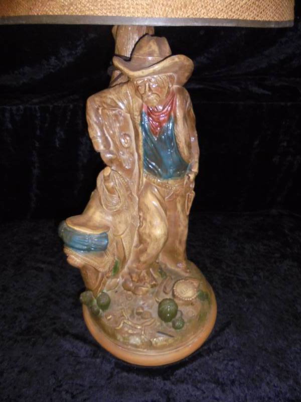 lot 29 image: Cowboy & Saddle Lamp 36hx17r
