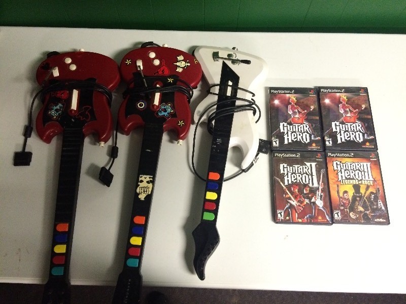 lot 13 image: 4 PLAYSTATION 2 GUITAR HERO GAMES
