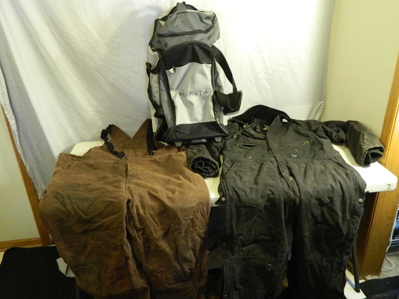 lot 57 image: Gander Mountain Guide Series Bibs, Walls Blizzard Pruf Coveralls, and Rolling Duffel Bag