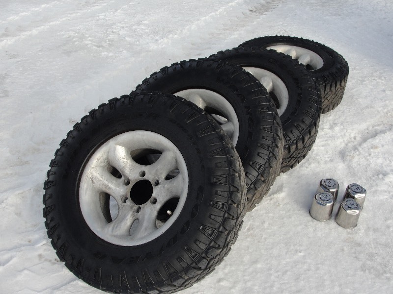 lot 1 image: Goodyear Wrangler Duratrac Tires with American Racing Wheels