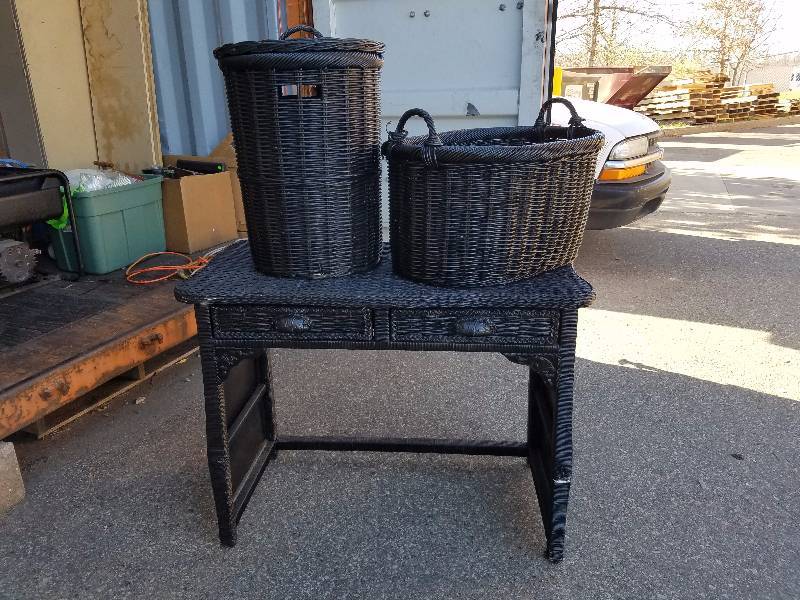 Wicker desk and laundry baskets.