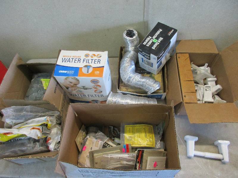 lot 107 image: misc lot - TP holders, dryer vent, weather stripping. buttons, water filter
