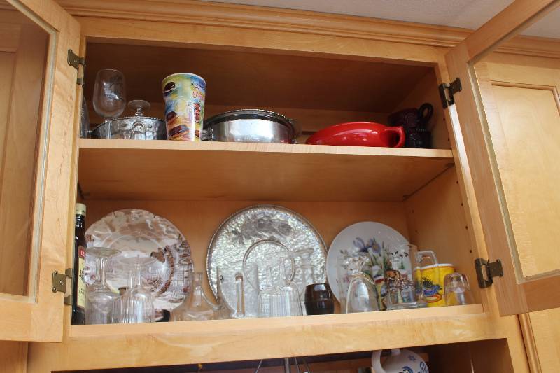 lot 55A image: Cupboard Lot of Decorations