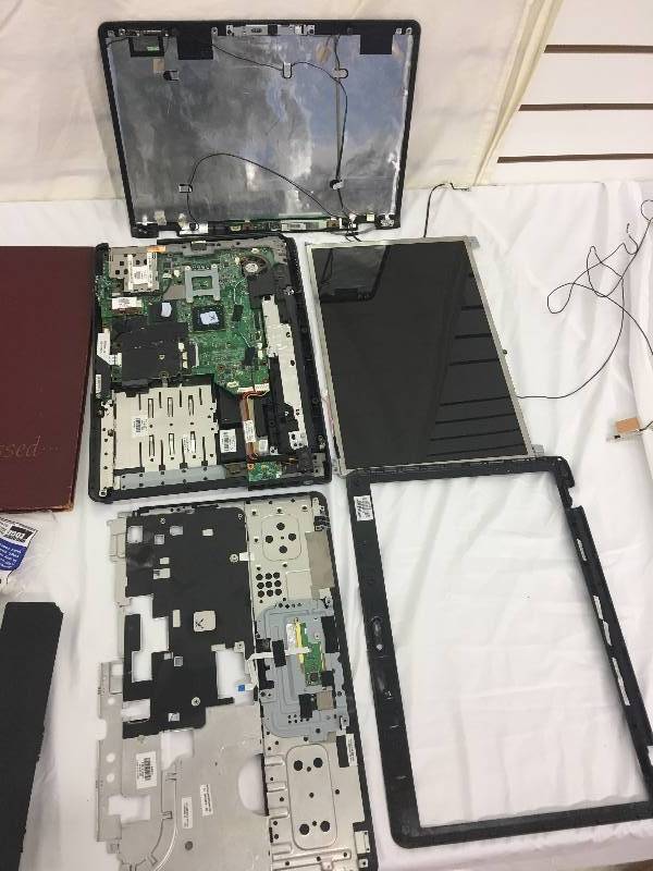 lot 86 image: taken apart laptop,radio,antique books