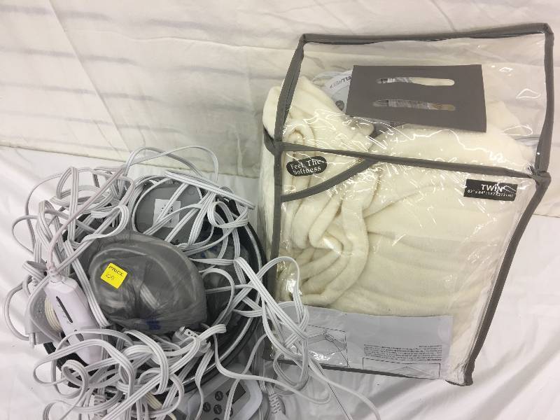 lot 108 image: heated blankets and large lot of power cords