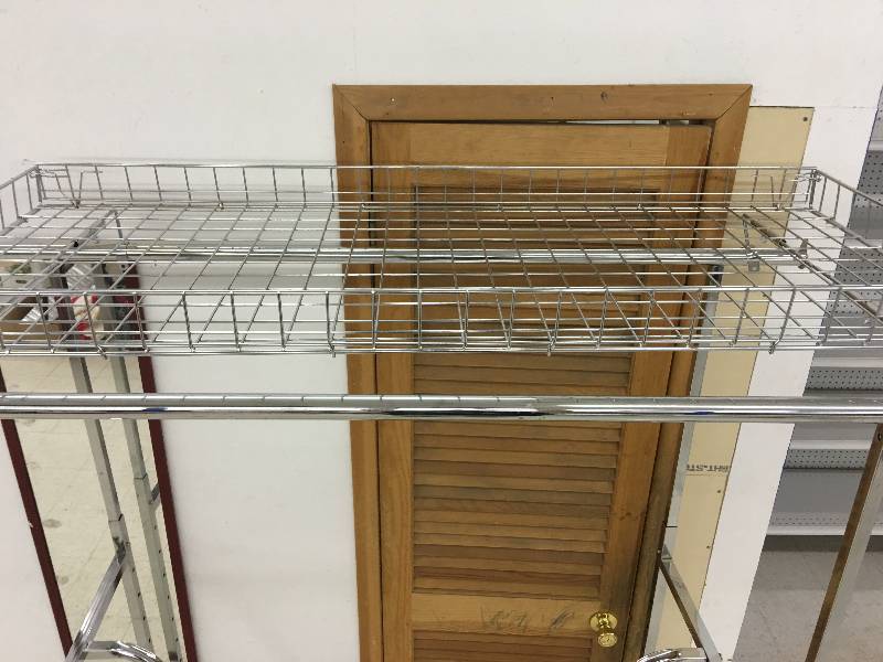 lot 39 image: Commercial clothing rack with top basket