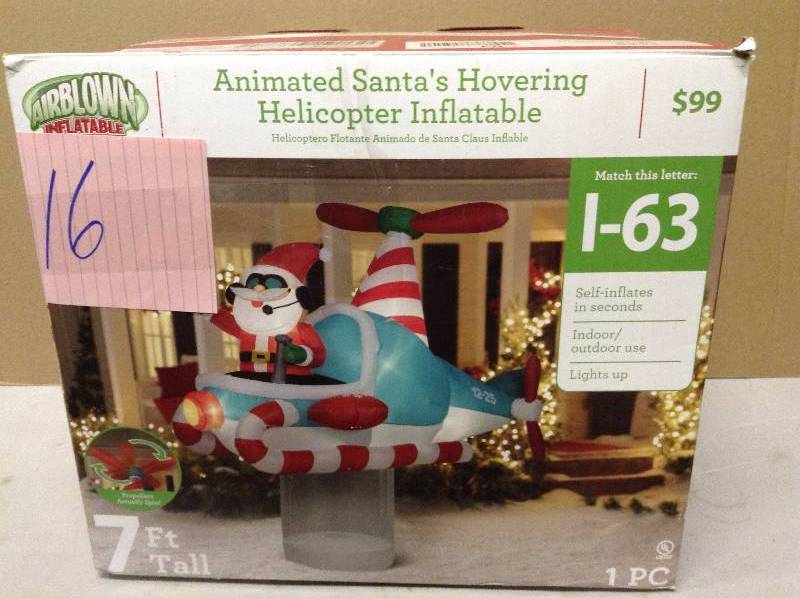 lot 16 image: Christmas Inflatable 7 Santa In Hovering Candy Cane Helicopter By Gemmy