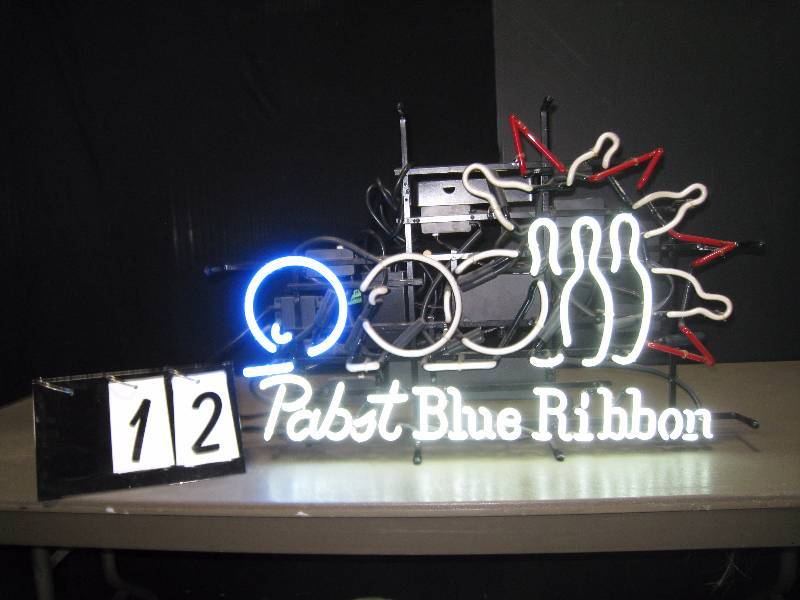 lot 12 image: Pabst Blue Ribbon animated bowling ball and pins neon sign. Strike This sign is awesome. Nice colors, cool animation.