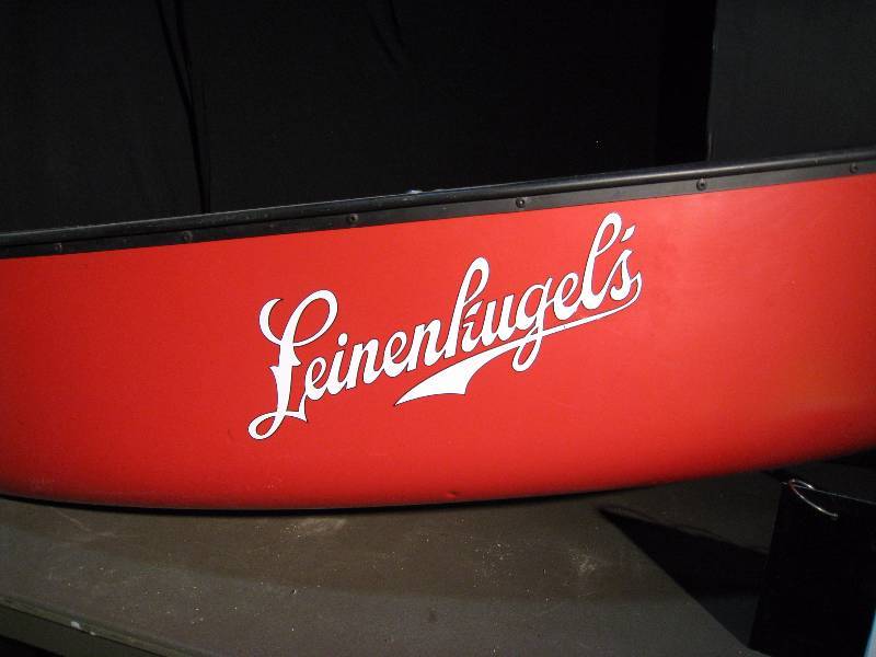 lot 18 image: Leinies We-No-Nah canoe. This very chill canoe is made to hold your ice and cold Leinenkugels Beer. Has a drain spout.