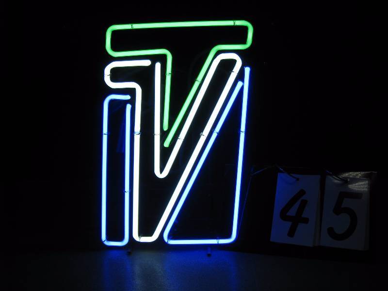 lot 45 image: TVN neon sign. Nice rich, stained glass colors.