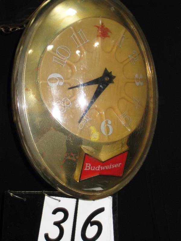 lot 36 image: Budweiser hanging clock, very cool, vintage - spins approx 2 RPM. Great retro piece.