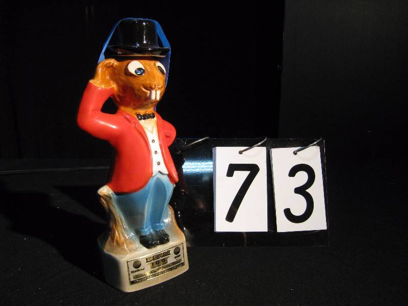 lot 73 image: Jim Beam, Beam 100 beaver decanter. Old ceramic liquor decanter.