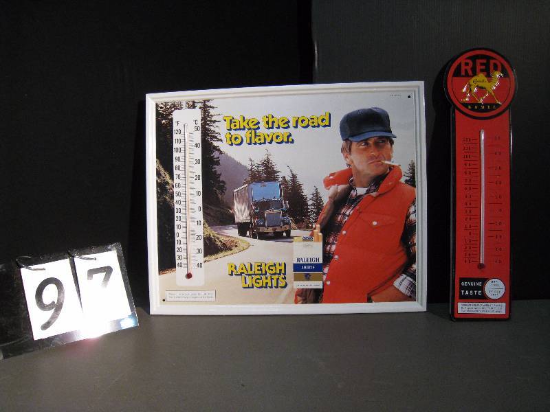 lot 97 image: 2 Signs in this lot Raleigh self framed tin - nice graphics 17 h x 21w, Camel Red thermometer tin 20 h x 4.5 w