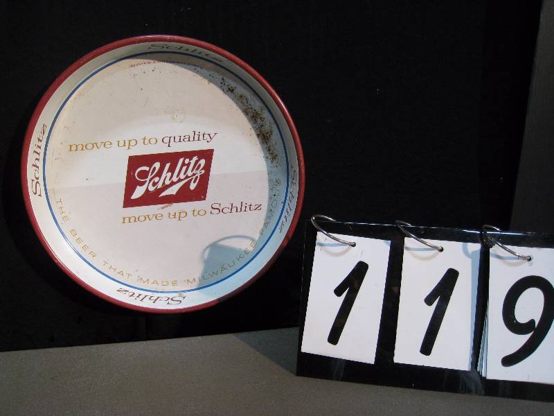 lot 119 image: Schlitz beer tray. Move Up to Quality back is white
