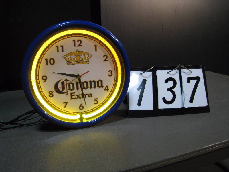 lot 137 image: Corona Extra neon clock, battery operated clock motor, works good, looks good