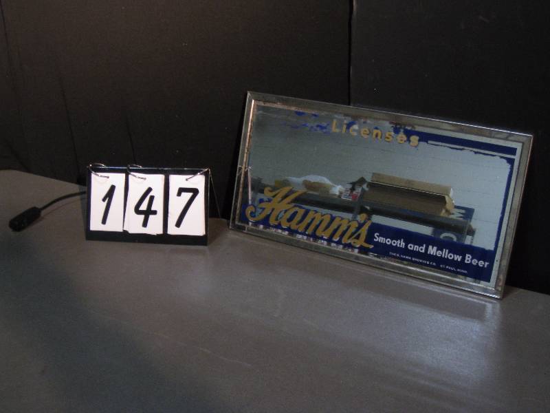 lot 147 image: 1940s Hamms Smooth and Mellow license holder, reverse on glass with chrome frame