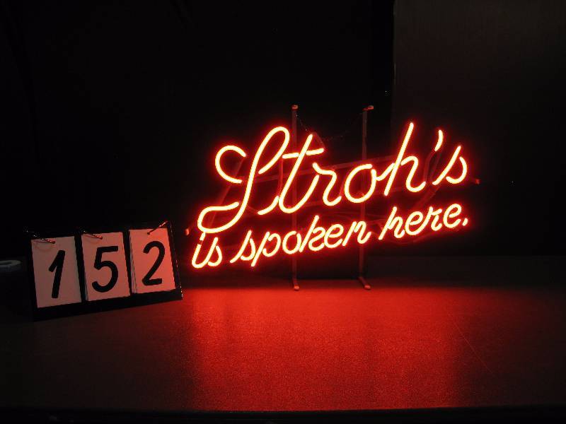 lot 152 image: Strohs is Spoken Here neon sign, classic, nice looking sign.