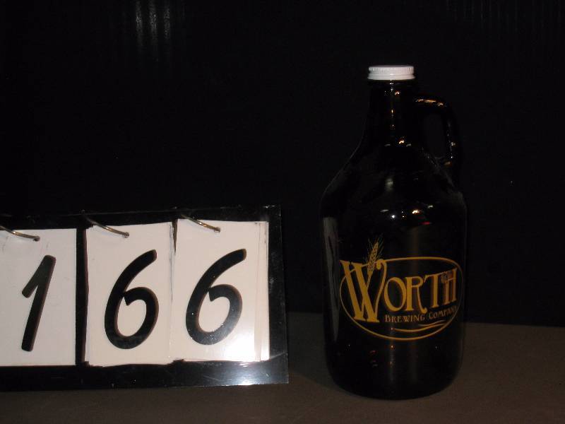 lot 166 image: Worth Brewing, glass growler 64 oz