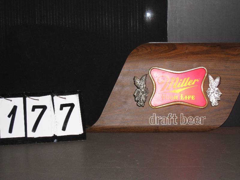lot 177 image: Miller High Life Draft Beer light up, curved plastic  faux wood grain. Mod and retro
