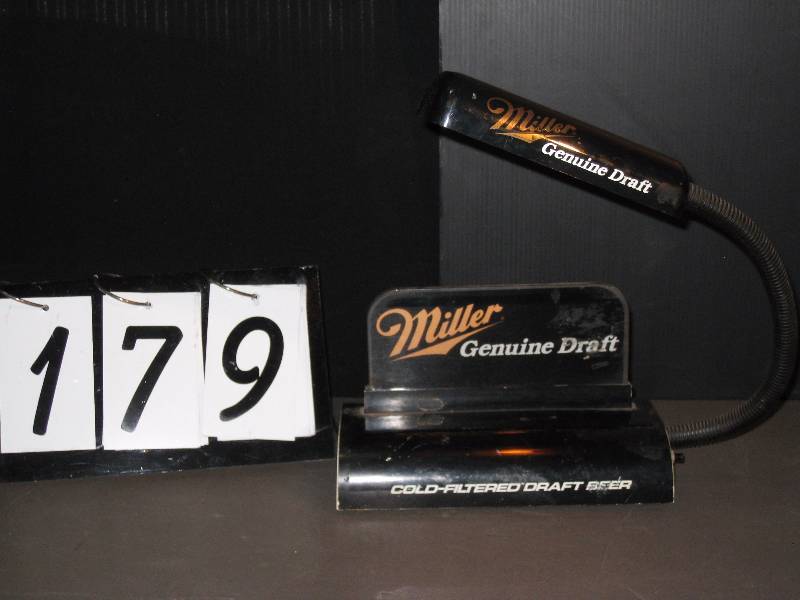 lot 179 image: Miller Genuine Draft cash register lamp with edgelit plastic logo and articulating arm with bulb