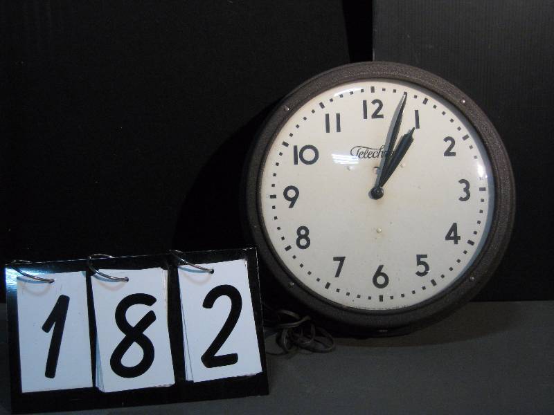 lot 182 image: School house clock, formed fiber clock body (not metal), glass front, aluminum back, Telechron motor, 1950s or 60s, keeps perfect time