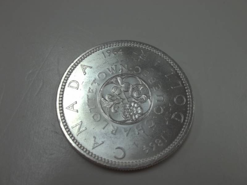 lot 114 image: 1964 CANADA SILVER DOLLAR COIN- CANADIAN CENTENNIAL SILVER COIN 80% Silver