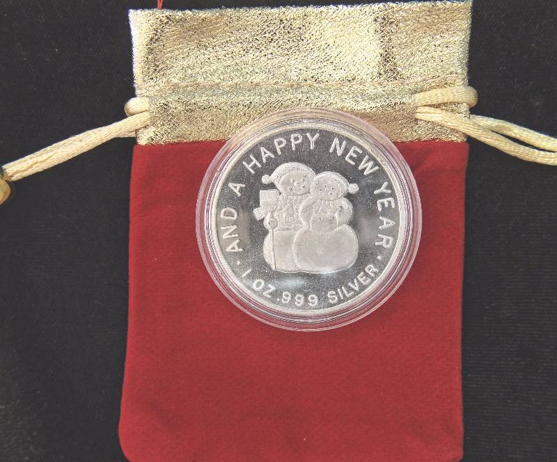 1 TROY OZ. .999 FINE SILVER CHRISTMAS ROUND IN AIRTITE WITH GIFT POUCH