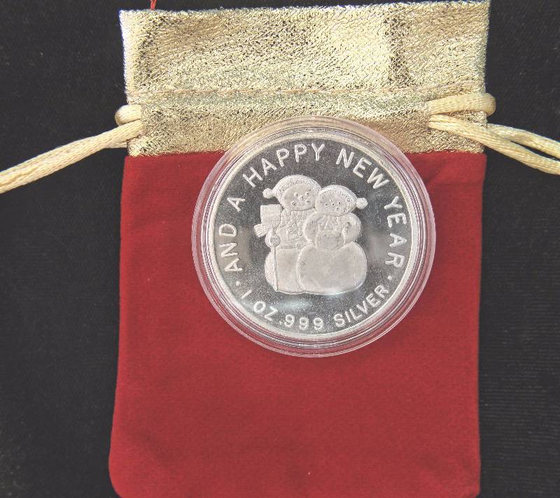 1 TROY OZ. .999 FINE SILVER CHRISTMAS ROUND IN AIRTITE WITH GIFT POUCH