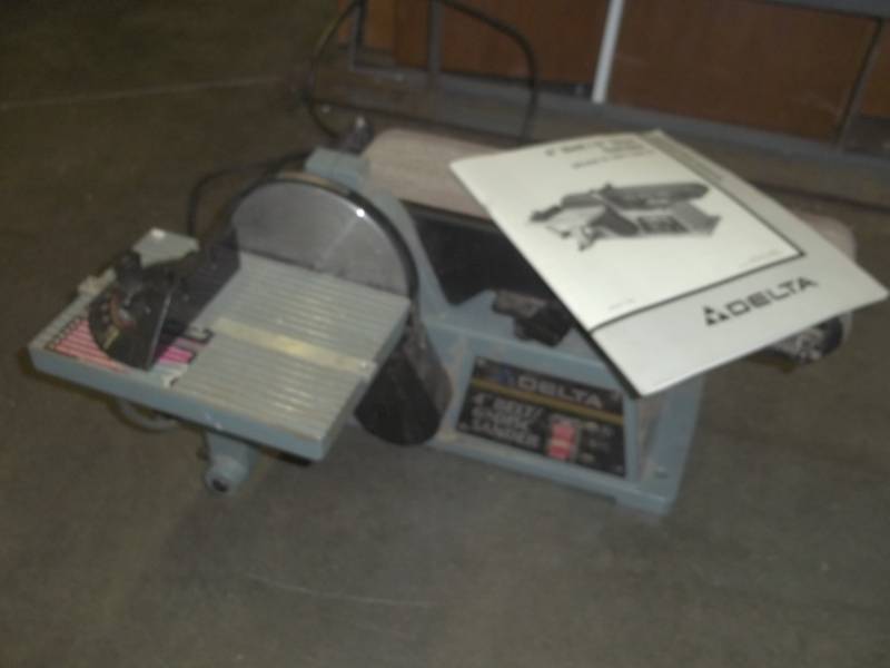 lot 5 image: Delta 4 inch belt 6 inch disc sander with manual