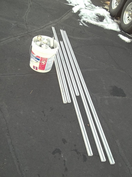 lot 13 image: Track lighting, includes three 8 pieces and three 4 pieces and 5 gallon pail of lights and accessories