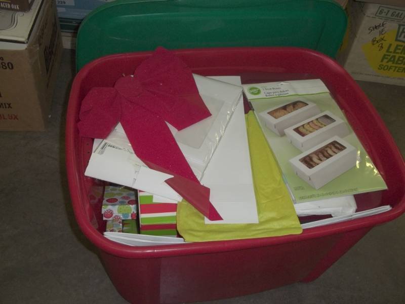 lot 57 image: Red Tote with Christmas boxes and bags  Cover is cracked