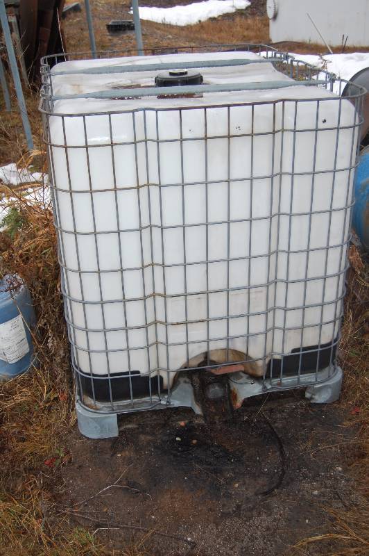 lot 261 image: Plastic Chemical Container with Steel Support Structure